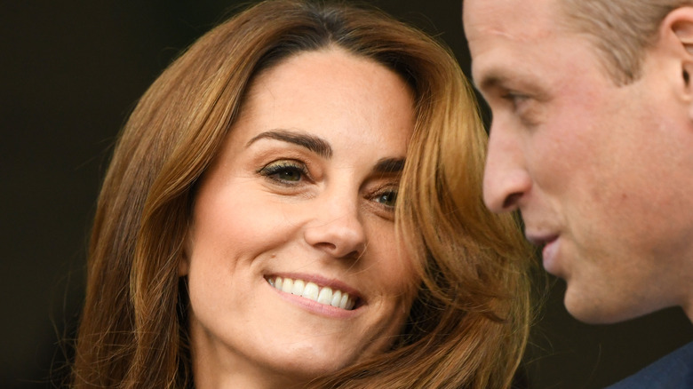 Kate Middleton posing with Prince William 