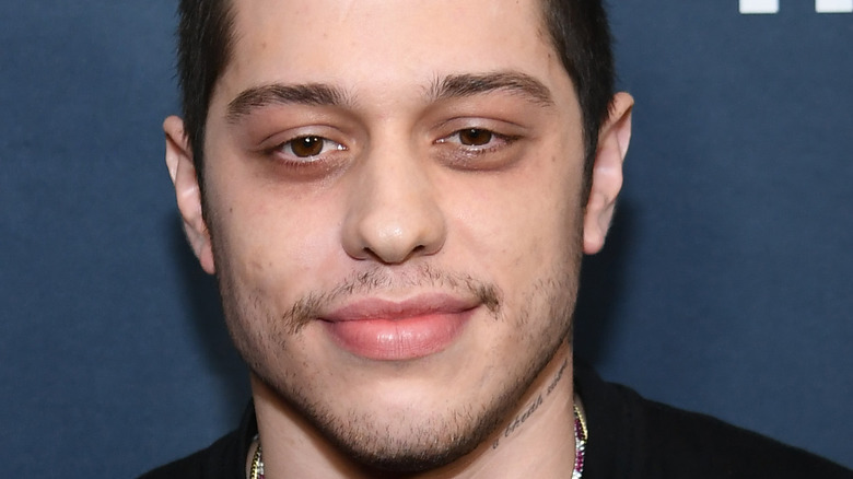Pete Davidson poses at an event