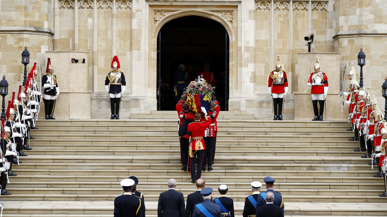 Pallbearers carrying Queen Elizabeth II's coffin