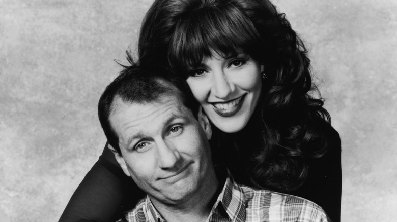 Ed O'Neill and Katey Sagal pose in a promo shot for Married...with Children