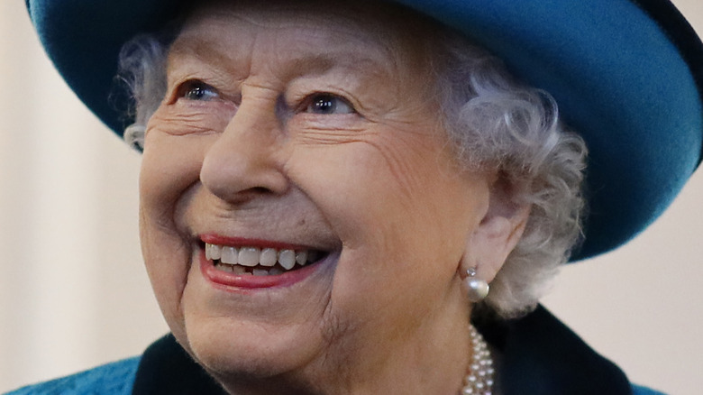 Queen Elizabeth in blue hat