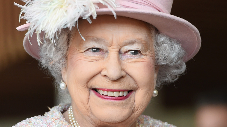 Queen Elizabeth, Meghan Markle and Prince Harry at Buckingham Palace