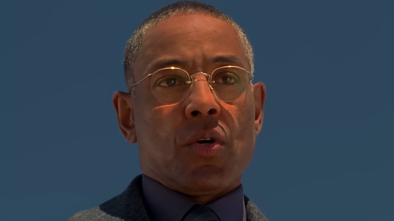 Giancarlo Esposito as Gus Fring on Breaking Bad, standing against a blue sky