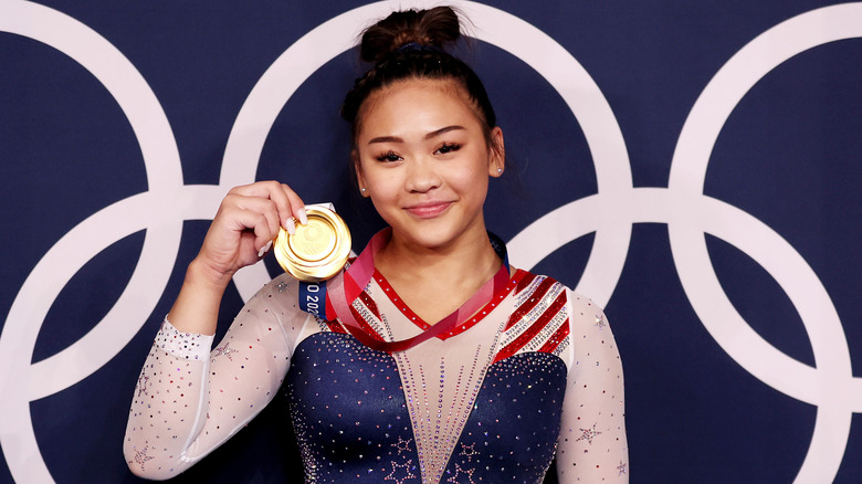 gymnastics star Sunisa Lee with gold medal