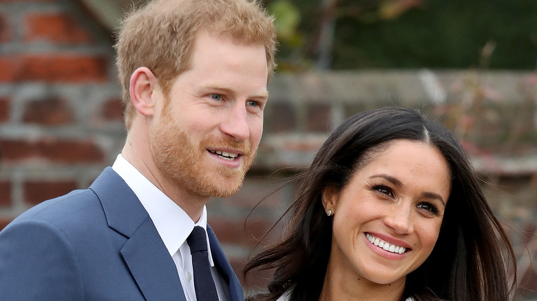 Prince Harry and Meghan Markle smiling together