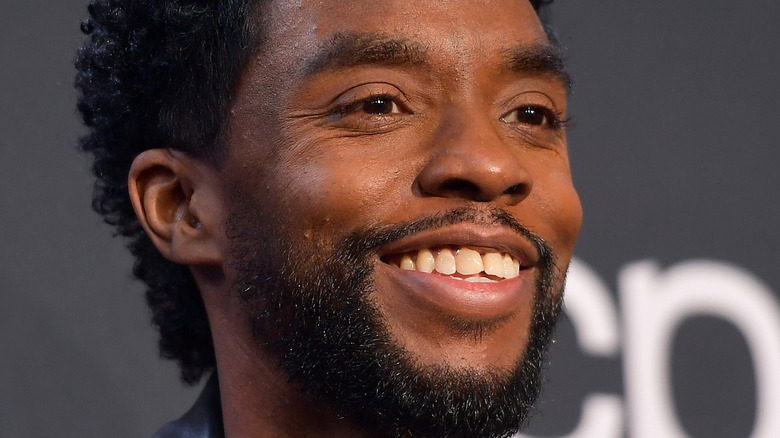 Chadwick Boseman smiling with facial hair