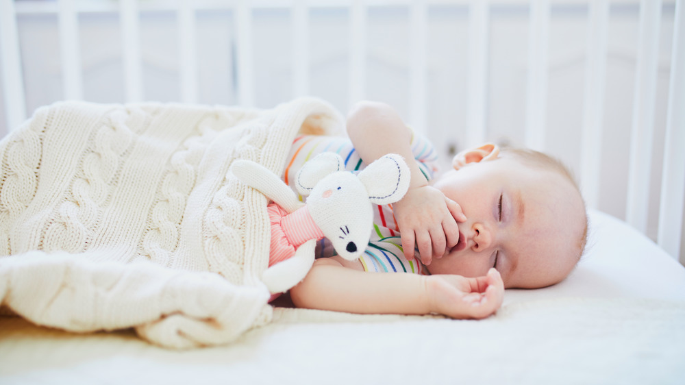 Baby sleeping in a crib