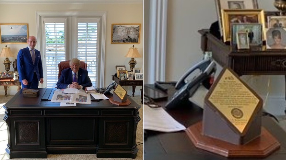 Stephen Miller and Donald Trump smile