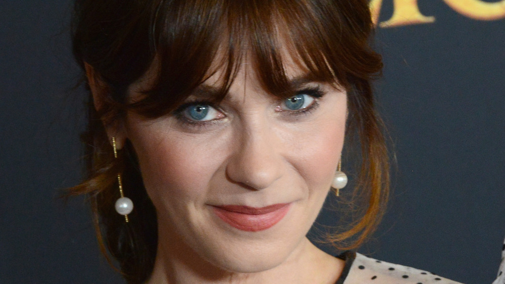 Zooey Deschanel grinning with bangs