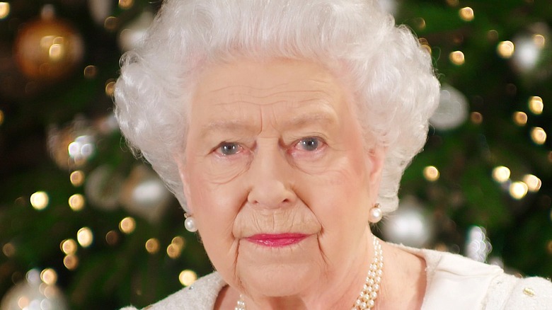Queen Elizabeth with Christmas tree background