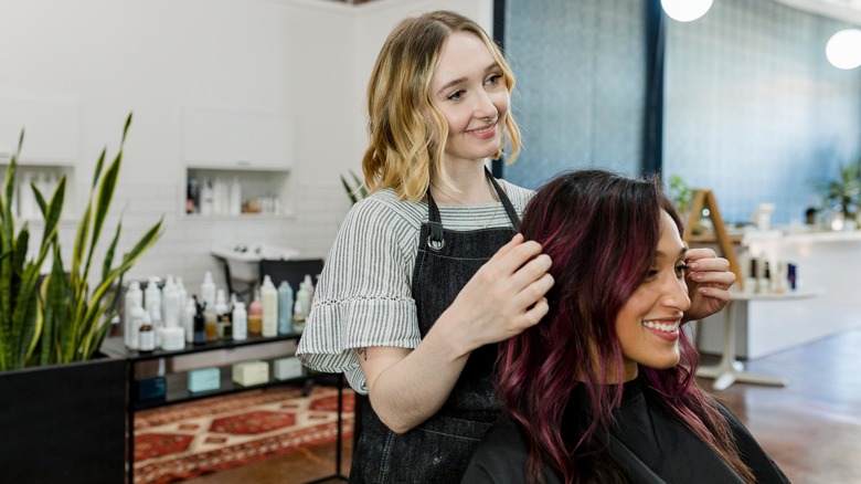 Woman getting her hair styled