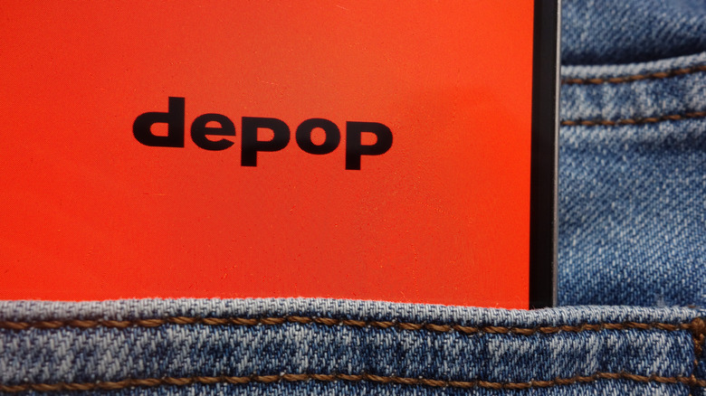 Depop logo on phone screen in pocket