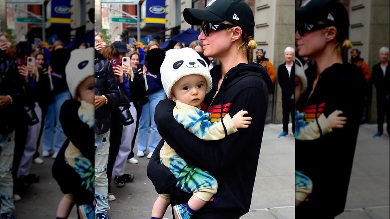 Paris Hilton holding her son Phoenix