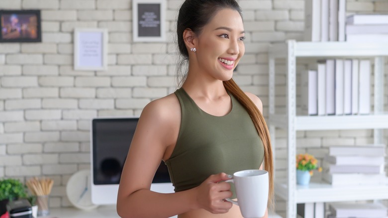 Woman smiling with mug