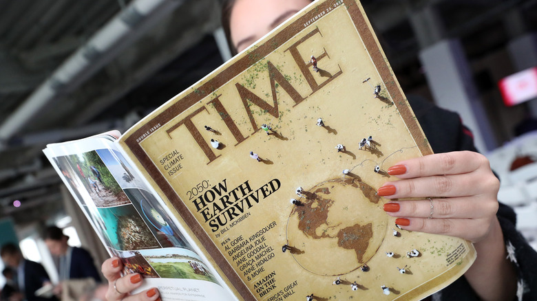 Woman reading TIME magazine