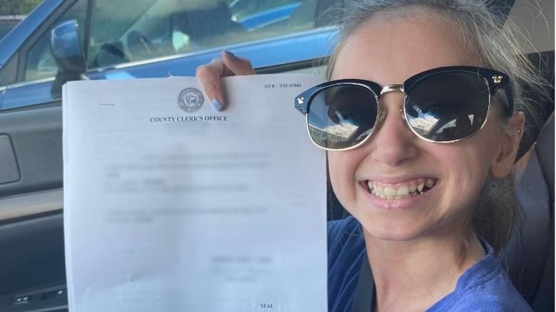 Shauna Rae holding name-change paperwork