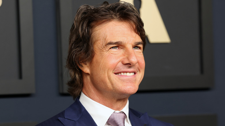 Tom Cruise smiling on the red carpet 
