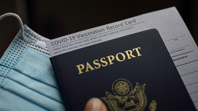 Passport, vaccine card, and mask