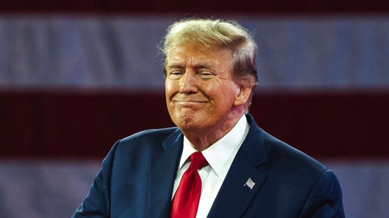 Donald Trump grimacing with wide smile and orange face