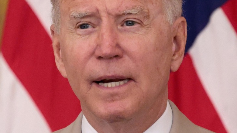 Biden in front of flag