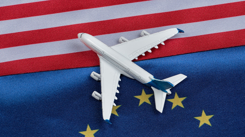 EU/US flags with small plane