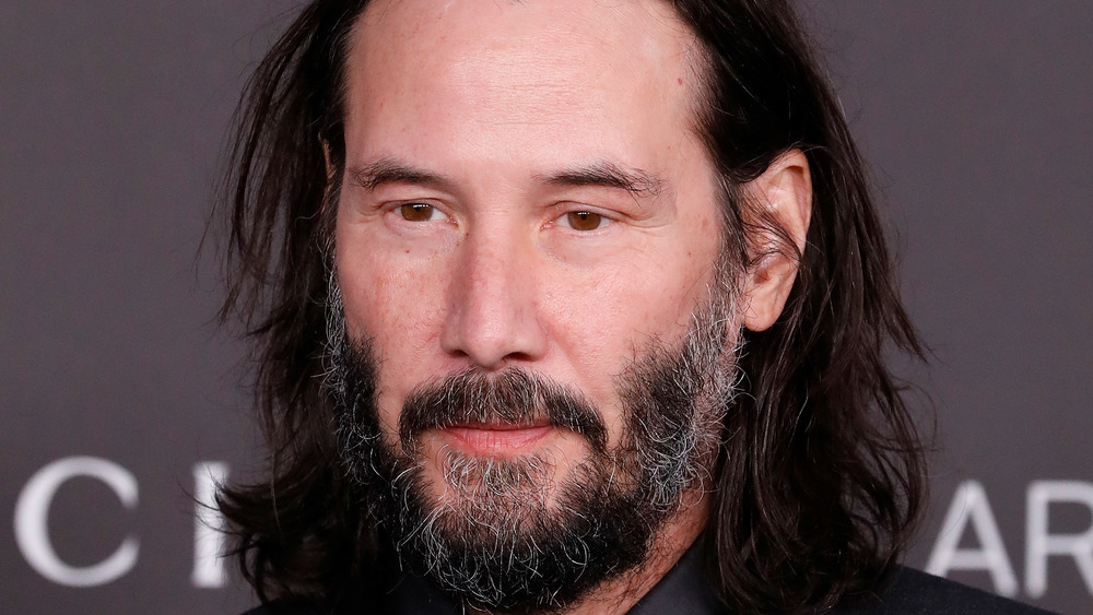 Keanu Reeves posing with a neutral expression