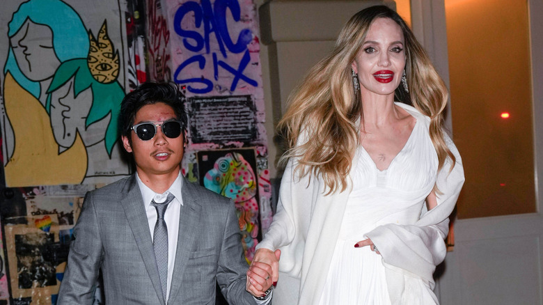 Pax Jolie-Pitt and Angelina Jolie walk hand in hand