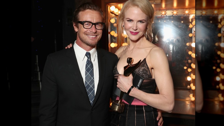 Simon Baker and Nicole Kidman posing at an event