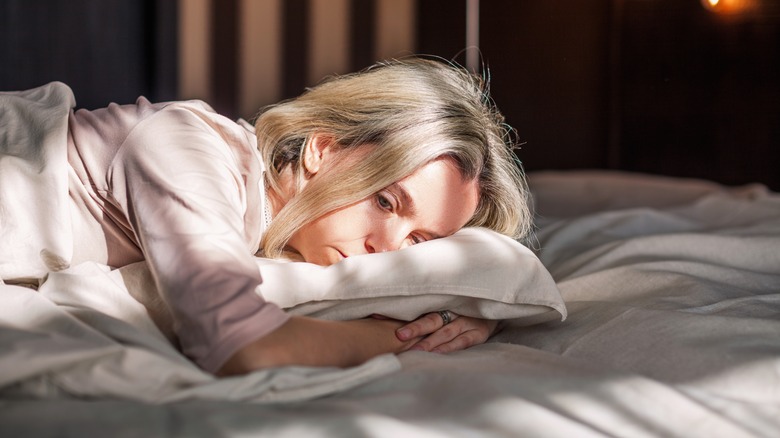 exhausted woman laying on pillow