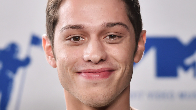 Pete Davidson smiles on the red carpet