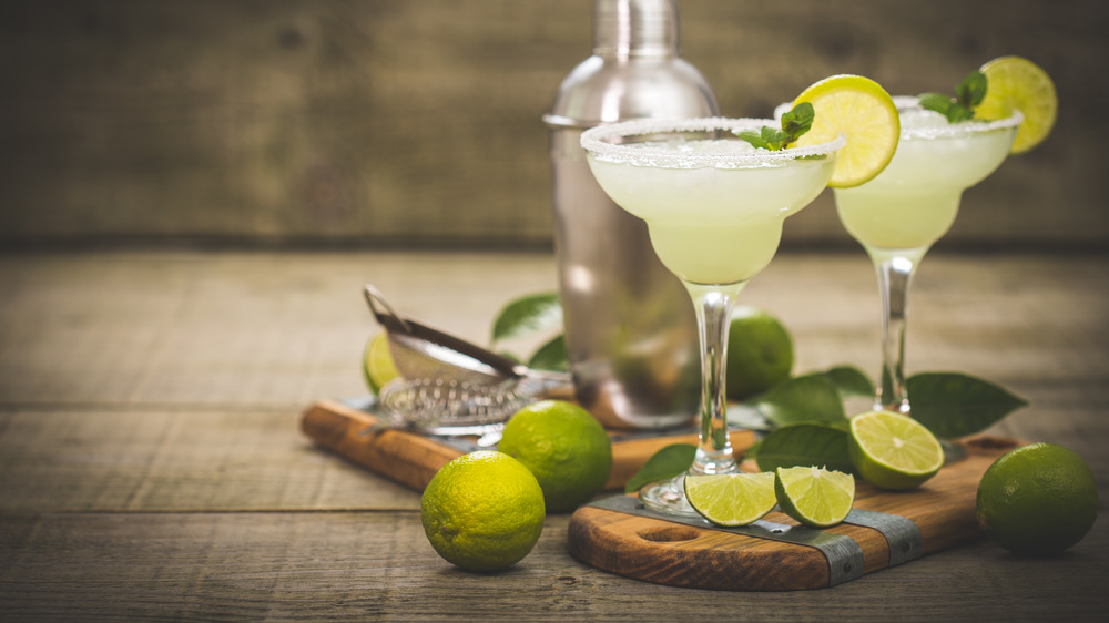 Margaritas garnished with lime