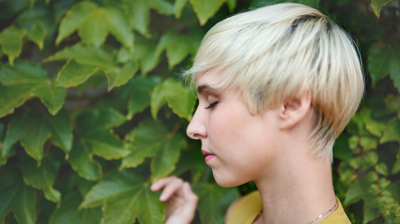 Woman with short platinum hair