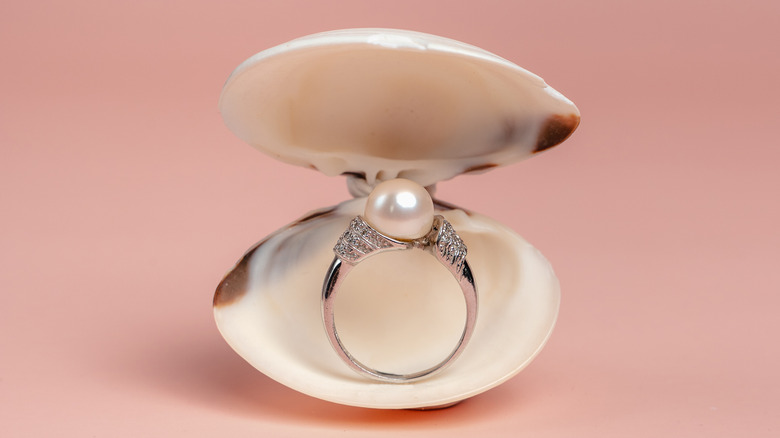 Pearl engagement ring in shell