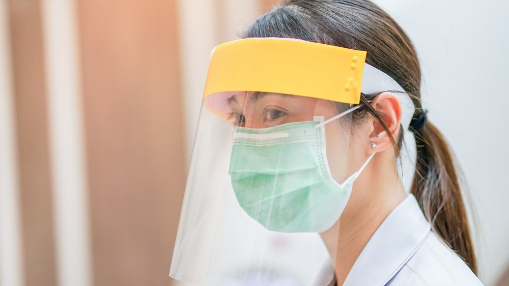 Face shield as used by a medical worker