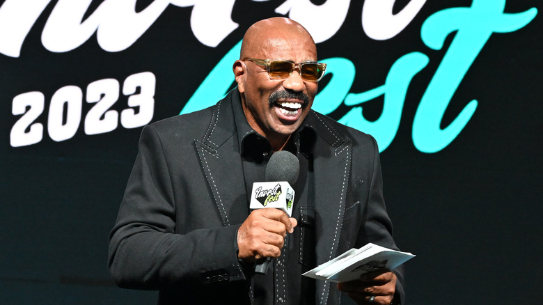 Steve Harvey onstage at Invest Fest