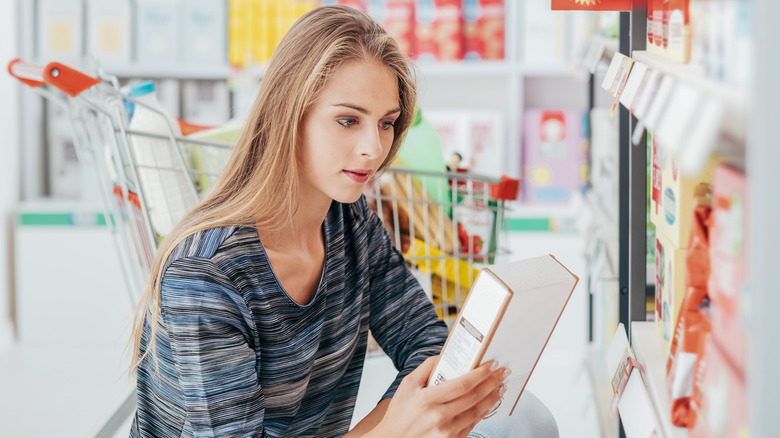 Woman checking food label