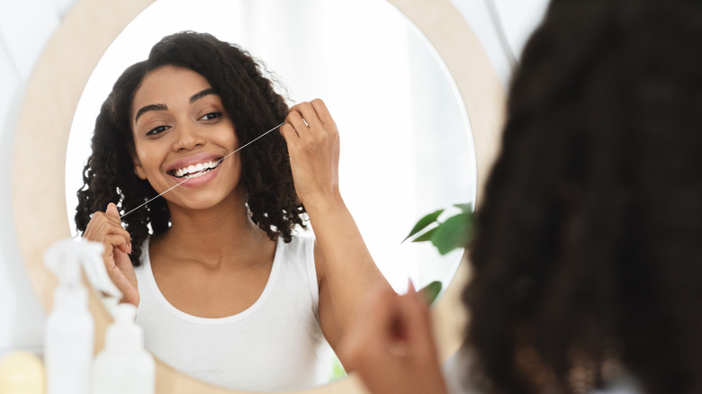 woman flossing