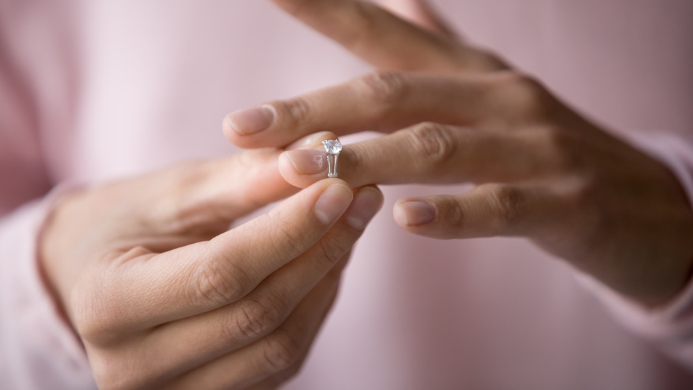 Woman putting on a ring