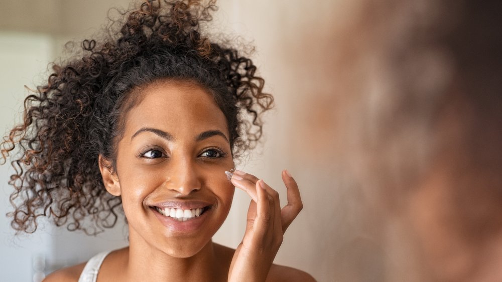 Woman applying cream