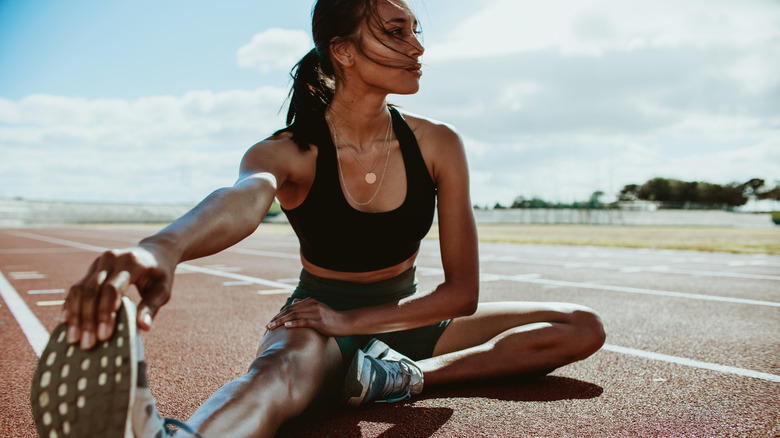 woman stretching for running, 