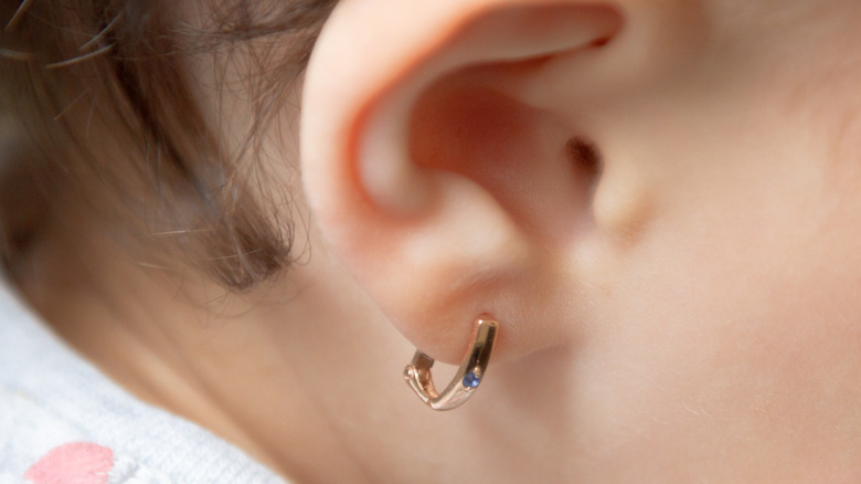 Baby ear with gold hoop earring