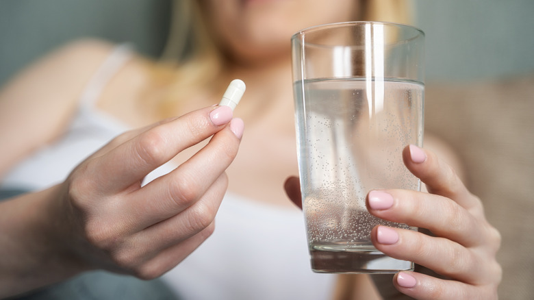 Woman taking a pill