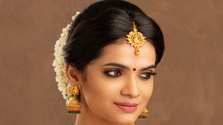 A woman wearing traditional Indian Tikka