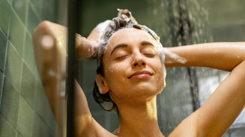 Woman washing her hair in the shower