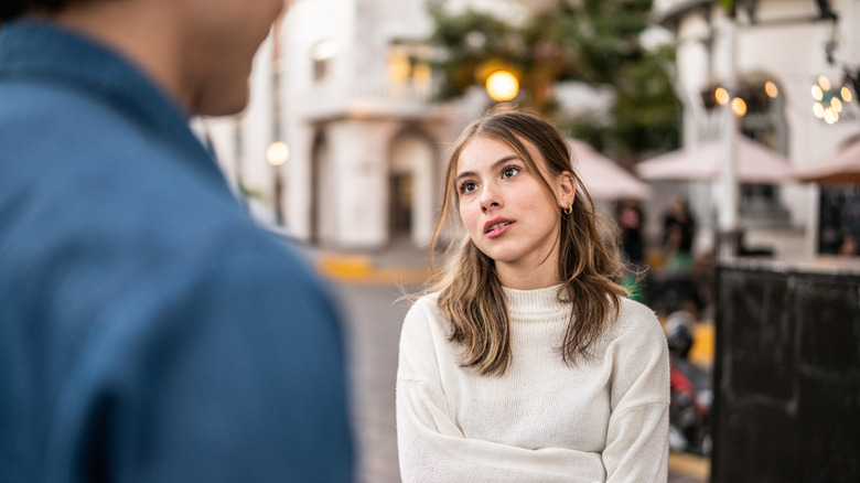 Woman looking unhappy at partner