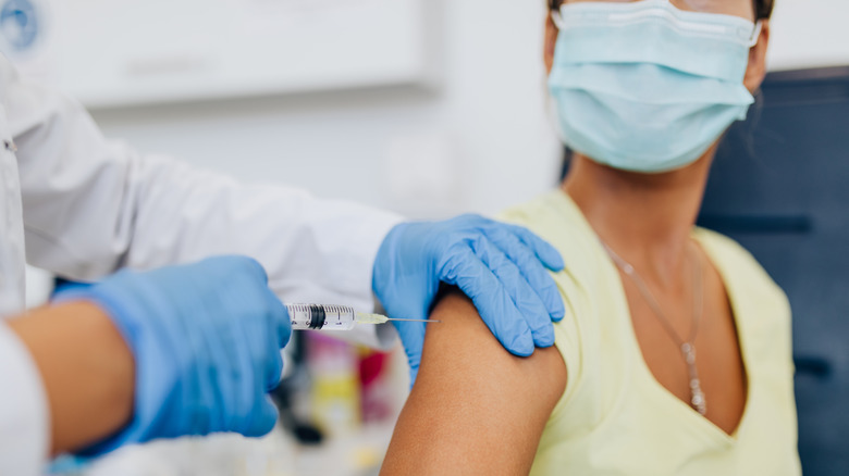 woman getting vaccine