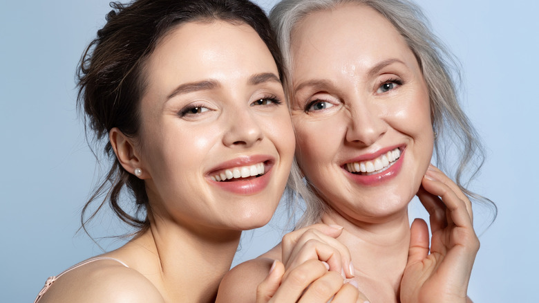 Two women smiling with two different hair colors