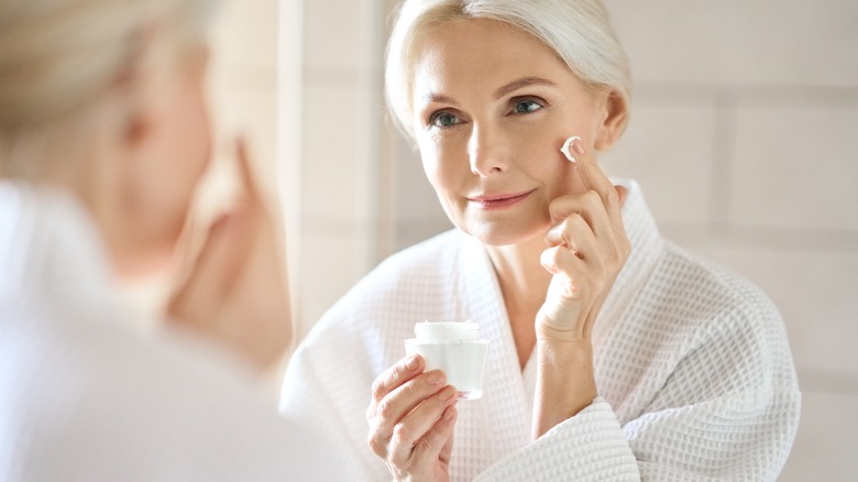 woman applying face cream