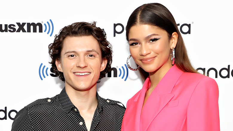 Tom Holland and Zendaya smiling