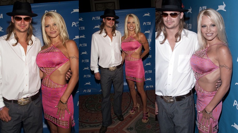 Kid Rock in a dress shirt and Pamela Anderson in a pink cutout dress